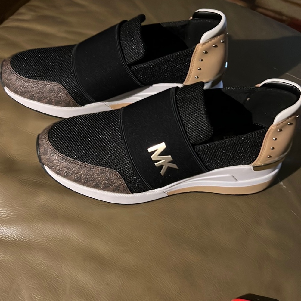 Michael Kors slip on shoes black, brown, white, and tan
